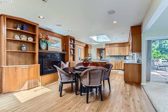 7145 SW Gable Pkwy, Portland, OR 97225 - dining room with light wood-style floors, a skylight, and recessed lighting