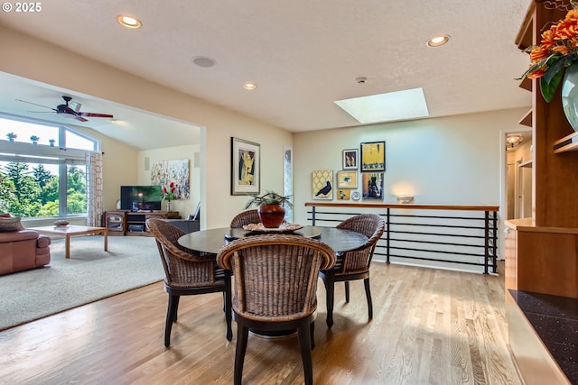 7145 SW Gable Pkwy, Portland, OR 97225 - dining room featuring a skylight, light wood-style flooring, a ceiling fan, and recessed lighting