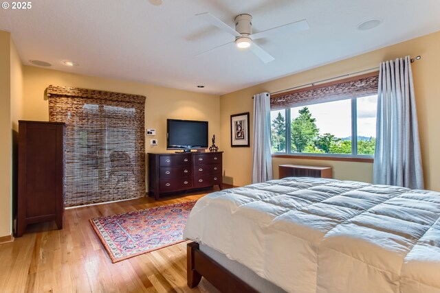 7145 SW Gable Pkwy, Portland, OR 97225 - bedroom with light wood-style floors and ceiling fan