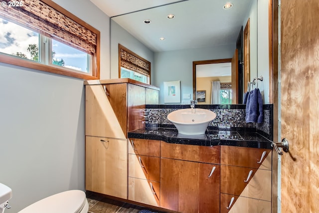 7145 SW Gable Pkwy, Portland, OR 97225 - half bathroom with vanity, recessed lighting, and decorative backsplash