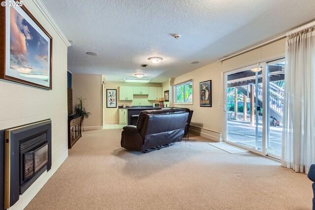 7145 SW Gable Pkwy, Portland, OR 97225 - living room with a textured ceiling, a glass covered fireplace, and light carpet
