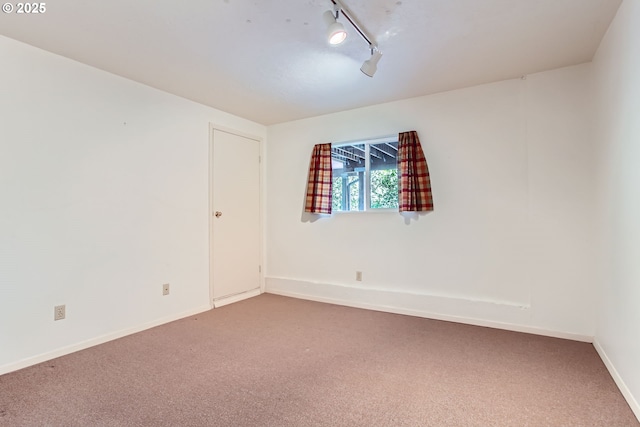 7145 SW Gable Pkwy, Portland, OR 97225 - empty room featuring carpet flooring and rail lighting