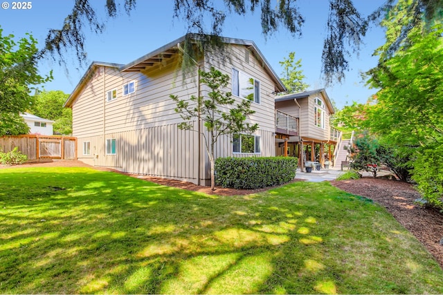 7145 SW Gable Pkwy, Portland, OR 97225 - rear view of house featuring stairs, board and batten siding, a patio, and a wooden deck