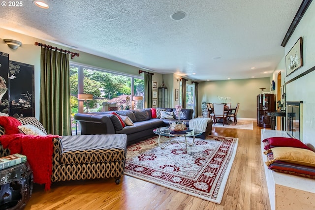 7145 SW Gable Pkwy, Portland, OR 97225 - living room with a textured ceiling, wood finished floors, and recessed lighting