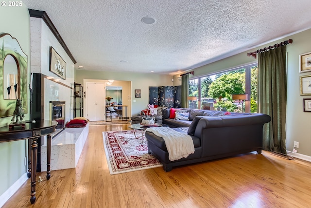 7145 SW Gable Pkwy, Portland, OR 97225 - living area featuring a textured ceiling and light wood finished floors
