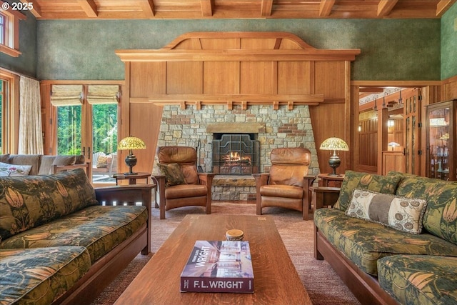 13150 SW Iron Mountain Blvd, Portland, OR 97219 - carpeted living room with beamed ceiling, a high ceiling, and a fireplace
