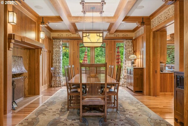 13150 SW Iron Mountain Blvd, Portland, OR 97219 - dining space featuring healthy amount of natural light, light wood-style flooring, beam ceiling, coffered ceiling, and wooden walls