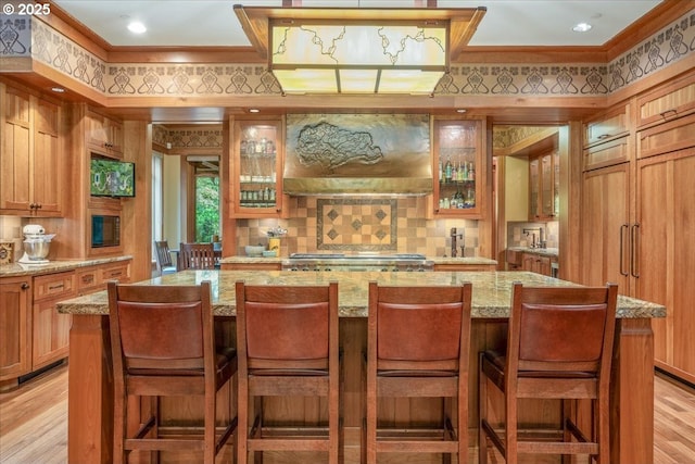13150 SW Iron Mountain Blvd, Portland, OR 97219 - indoor bar with ornamental molding, tasteful backsplash, light wood-style flooring, and range
