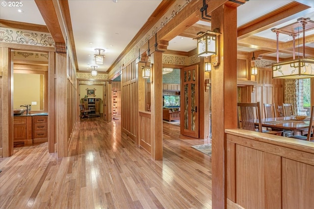 13150 SW Iron Mountain Blvd, Portland, OR 97219 - corridor featuring light wood-type flooring and crown molding