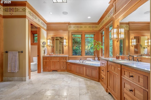 13150 SW Iron Mountain Blvd, Portland, OR 97219 - bathroom featuring vanity, toilet, a bath, ornamental molding, and baseboards