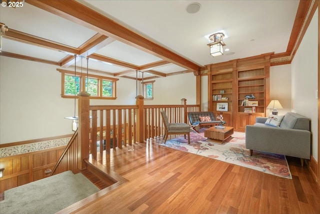 13150 SW Iron Mountain Blvd, Portland, OR 97219 - living area featuring wood finished floors, an upstairs landing, and beam ceiling