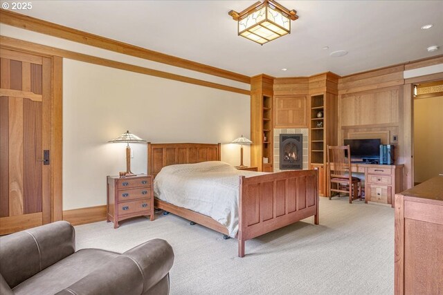 13150 SW Iron Mountain Blvd, Portland, OR 97219 - bedroom featuring light colored carpet and a warm lit fireplace