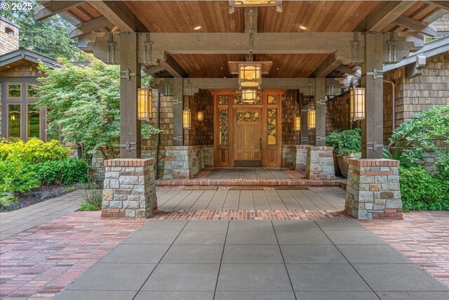 13150 SW Iron Mountain Blvd, Portland, OR 97219 - view of exterior entry featuring a porch and stone siding