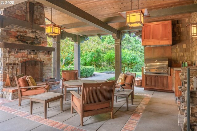 13150 SW Iron Mountain Blvd, Portland, OR 97219 - view of patio / terrace featuring an outdoor stone fireplace