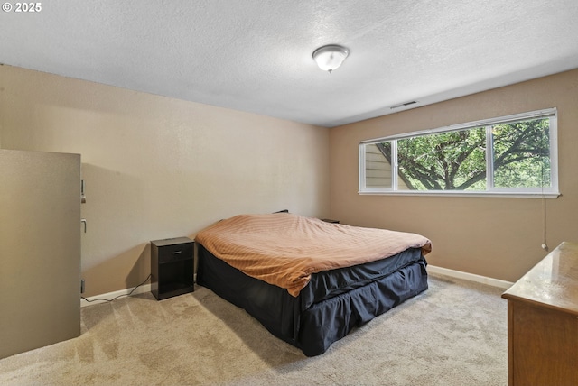 1621 NE 113th St Unit 132, Vancouver, WA 98686 - bedroom featuring light colored carpet, a textured ceiling, and baseboards