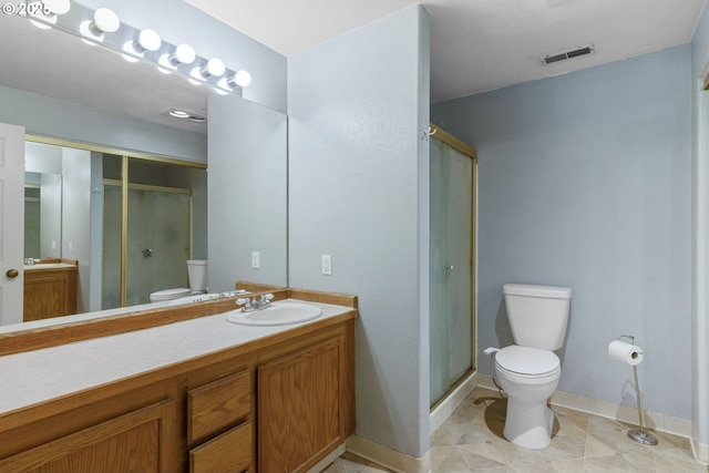 1621 NE 113th St Unit 132, Vancouver, WA 98686 - bathroom featuring toilet, baseboards, a stall shower, and vanity