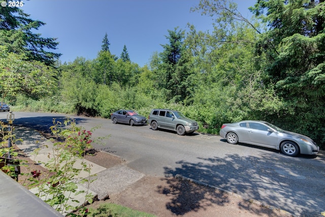 1621 NE 113th St Unit 132, Vancouver, WA 98686 - view of parking / parking lot featuring a wooded view