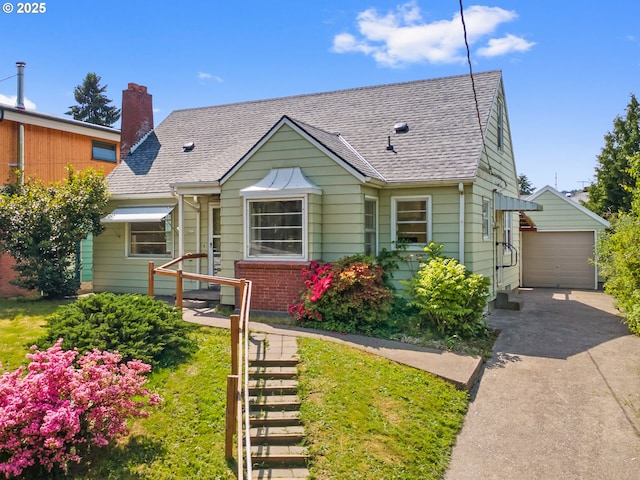 4315 SE 28th Pl, Portland, OR 97202 - view of front of property with driveway, an outdoor structure, a shingled roof, a chimney, and a detached garage