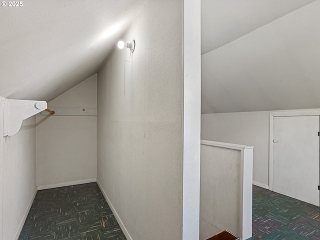 4315 SE 28th Pl, Portland, OR 97202 - bonus room featuring vaulted ceiling, baseboards, and a textured ceiling