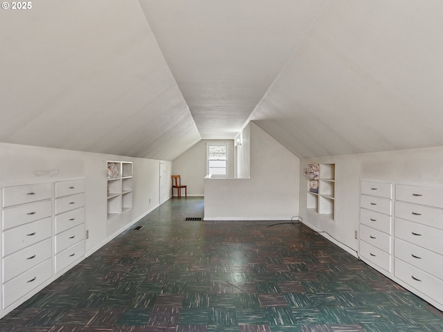 4315 SE 28th Pl, Portland, OR 97202 - additional living space with built in features, vaulted ceiling, and baseboards