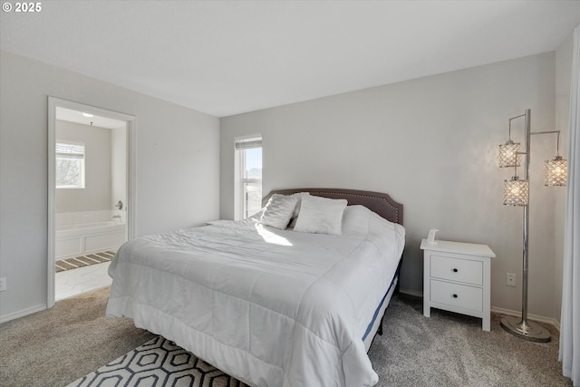 bedroom with carpet and ensuite bathroom