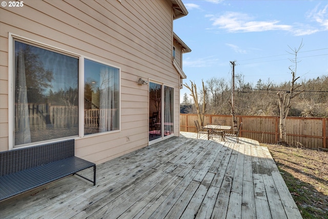 wooden deck featuring fence