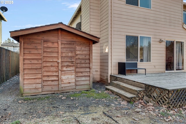 view of shed with fence