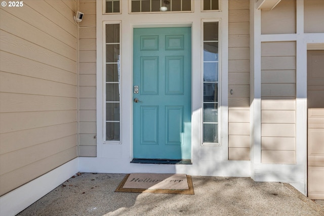 doorway to property featuring a garage