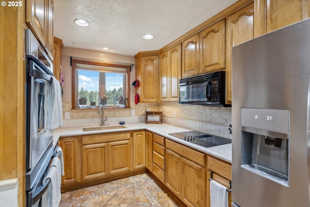 28272 S Hult Rd, Beavercreek, OR 97004 - kitchen featuring black appliances, a sink, inlaid floor details, light countertops, and decorative backsplash