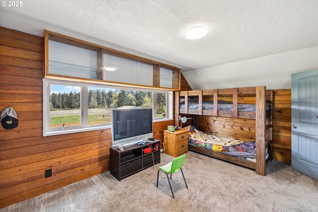 28272 S Hult Rd, Beavercreek, OR 97004 - carpeted bedroom featuring a textured ceiling, lofted ceiling, and wooden walls