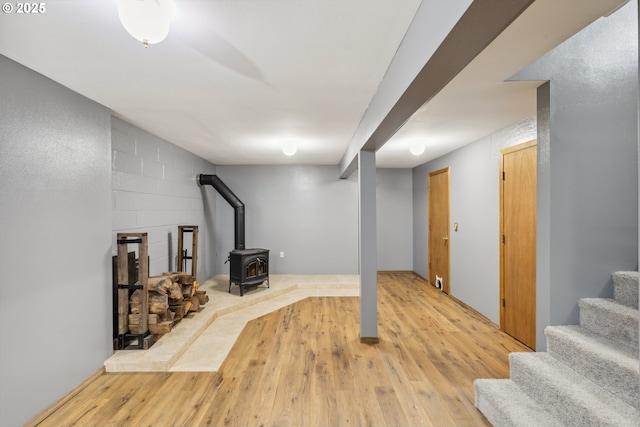 28272 S Hult Rd, Beavercreek, OR 97004 - finished below grade area featuring a wood stove, light wood-style flooring, and stairs
