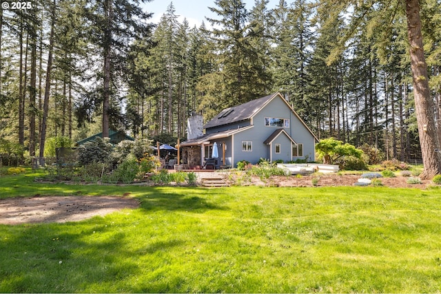 28272 S Hult Rd, Beavercreek, OR 97004 - rear view of property with a lawn and a chimney