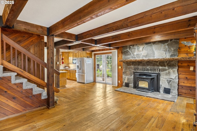 28272 S Hult Rd, Beavercreek, OR 97004 - unfurnished living room featuring light wood-style floors, beam ceiling, and stairway