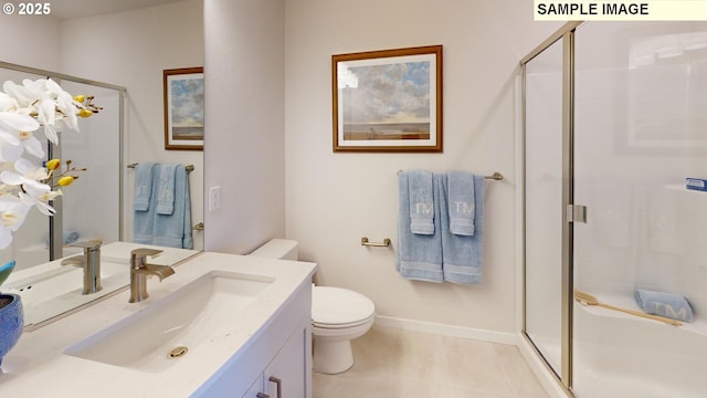 bathroom with vanity, tile patterned floors, a shower with door, and toilet