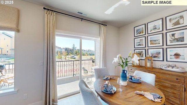 dining room with light hardwood / wood-style floors