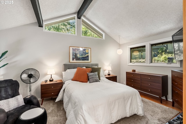 interior space featuring a textured ceiling, wood finished floors, plenty of natural light, and visible vents
