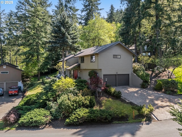view of front of property with driveway and an attached garage