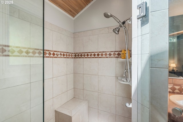 bathroom with tile patterned floors, a shower stall, backsplash, toilet, and vanity
