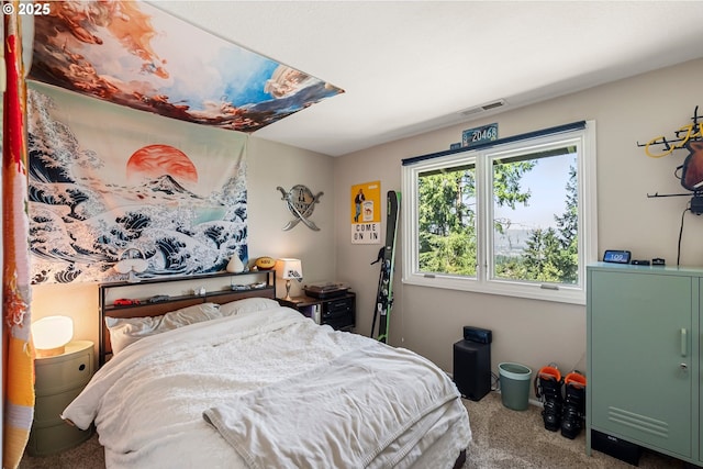 carpeted bedroom with visible vents