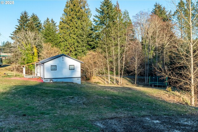 1502 Columbia St, Cathlamet, WA 98612 - view of yard featuring a trampoline