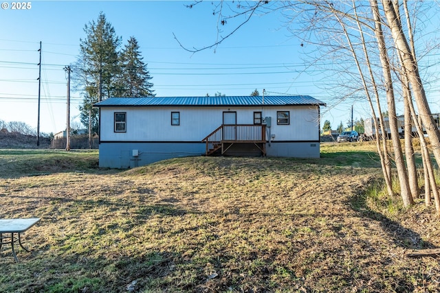 1502 Columbia St, Cathlamet, WA 98612 - rear view of house featuring a yard, crawl space, and metal roof