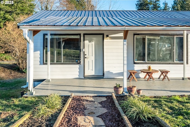 1502 Columbia St, Cathlamet, WA 98612 - view of exterior entry featuring a porch, a standing seam roof, and metal roof