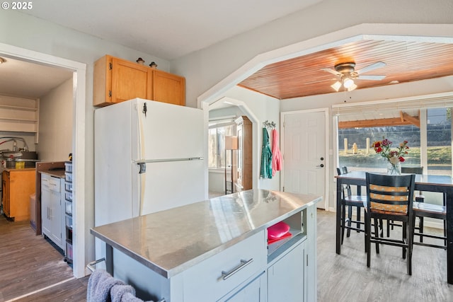 1502 Columbia St, Cathlamet, WA 98612 - kitchen with freestanding refrigerator, wood finished floors, and a wealth of natural light