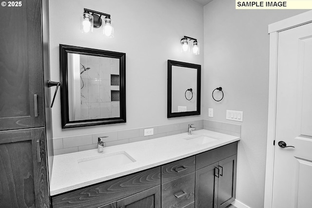 bathroom with a sink and double vanity