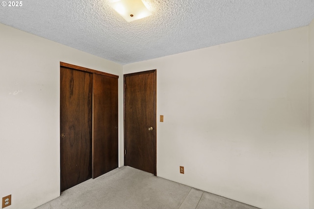 233 SE Paloma Ave, Gresham, OR 97080 - unfurnished bedroom with a closet, a textured ceiling, and light carpet