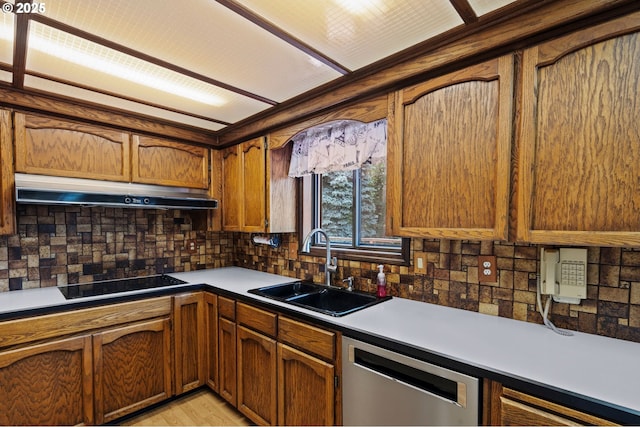 233 SE Paloma Ave, Gresham, OR 97080 - kitchen featuring dishwasher, under cabinet range hood, black electric cooktop, and tasteful backsplash