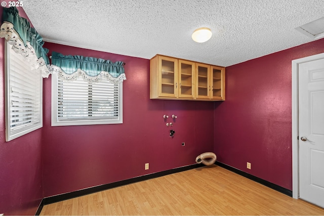 233 SE Paloma Ave, Gresham, OR 97080 - washroom with light wood-style flooring and a textured ceiling