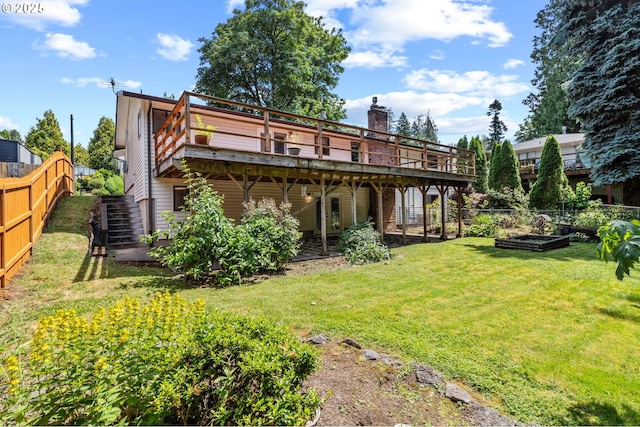 233 SE Paloma Ave, Gresham, OR 97080 - back of property featuring a vegetable garden, a deck, stairs, and a chimney