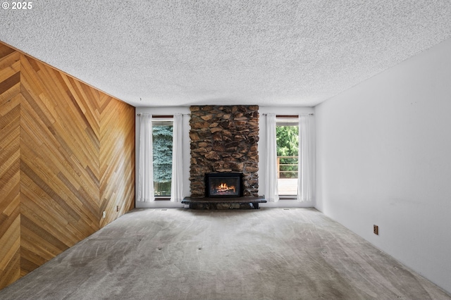 233 SE Paloma Ave, Gresham, OR 97080 - unfurnished living room with carpet flooring, a fireplace, and a textured ceiling