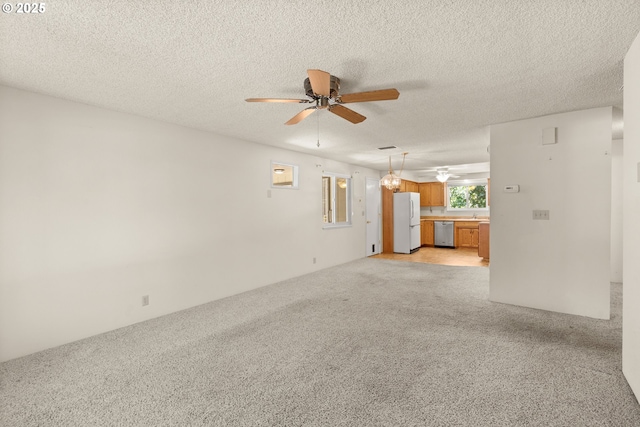 713 Brookside Cir, Rogue River, OR 97537 - unfurnished living room featuring ceiling fan, light colored carpet, and a textured ceiling